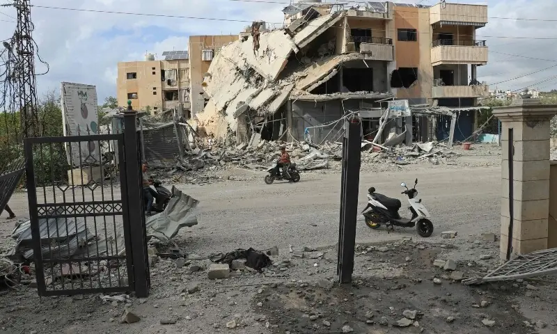 First responders clear the debris near the site of an Israeli airstrike that targeted the headquarters of a local NGO, in the southern coastal city of Tyre on May 15, 2026. &mdash;AFP