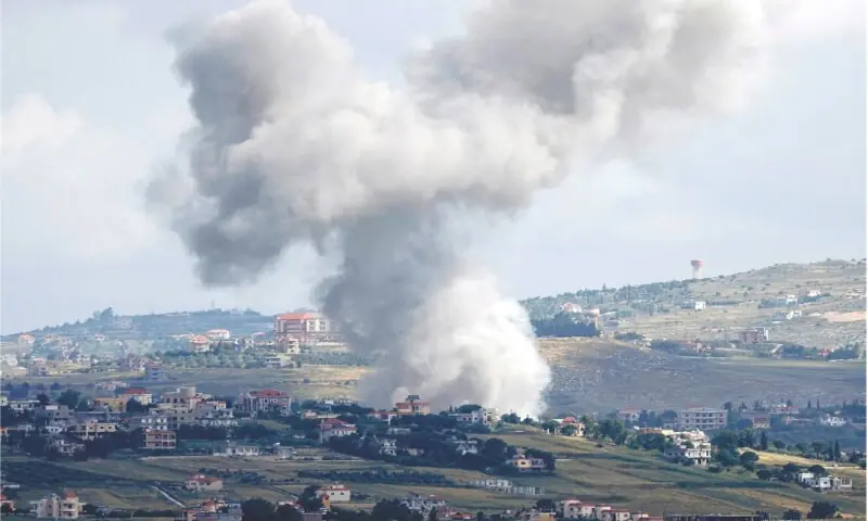 Smoke billowing above the Lebanese village of Mays al-Jabal during Israeli bombardment, on Sunday.&mdash;AFP/File