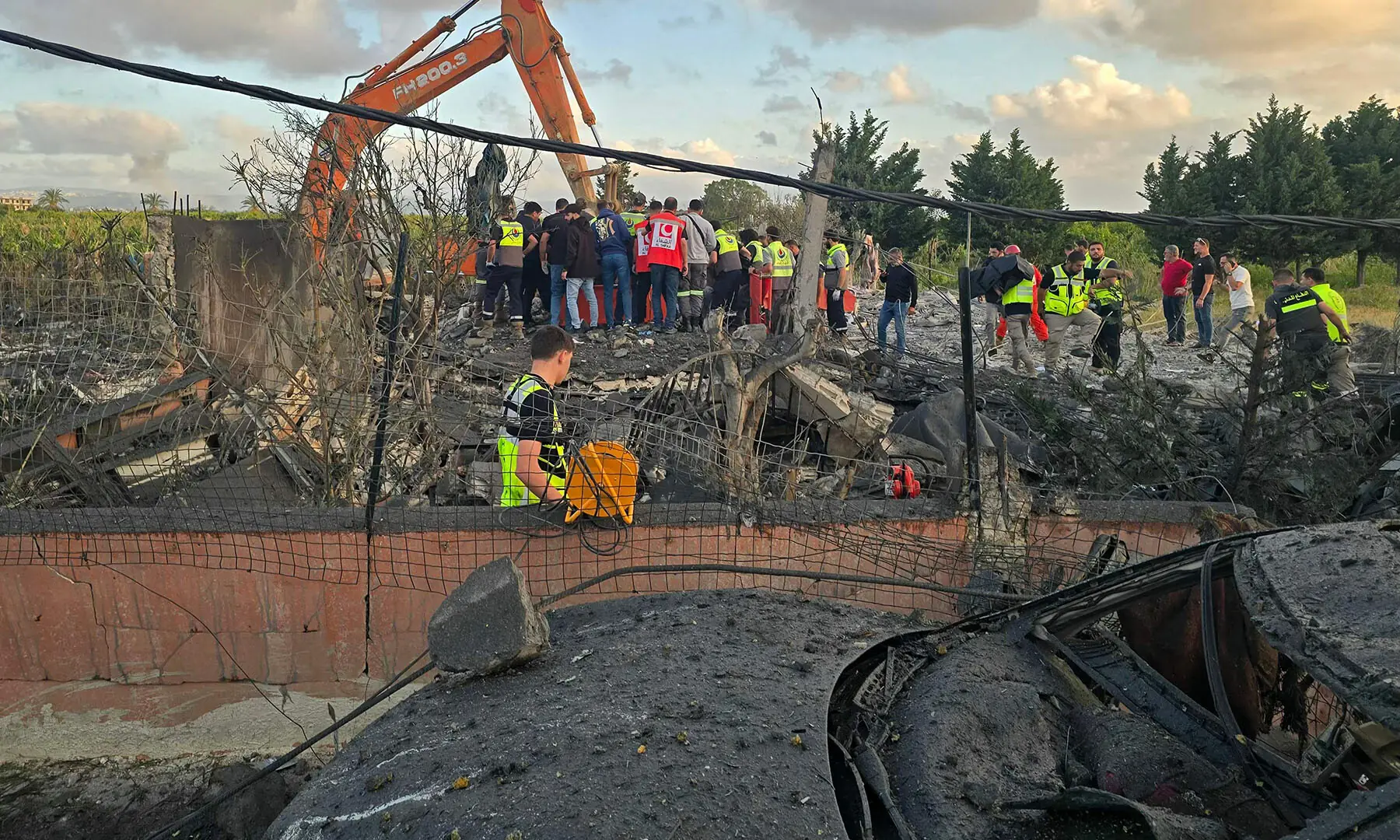 First responders gather at the site of an Israeli airstrike that targeted an area in the suburbs of the southern Lebanese coastal city of Tyre on May 16, 2026. &mdash; AFP