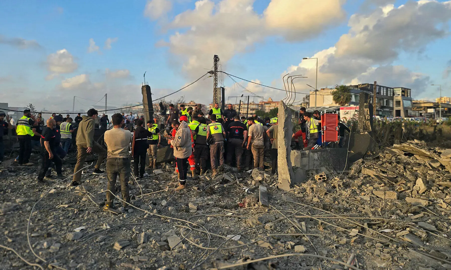 First responders gather at the site of an Israeli airstrike that targeted an area in the suburbs of the southern Lebanese coastal city of Tyre on May 16, 2026. &mdash; AFP