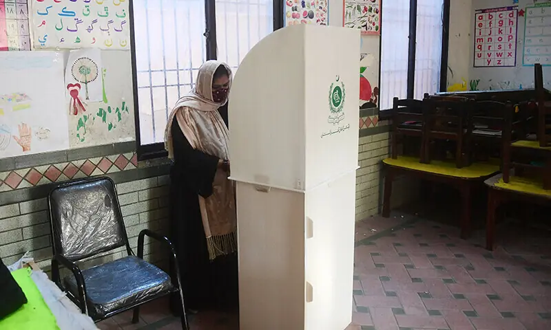A woman marks her ballot to vote at a polling station during Pakistan's national elections in Karachi on February 8, 2024 — AFP/File A woman marks her ballot to vote at a polling station during Pakistan's national elections in Karachi on February 8, 2024 — AFP/File