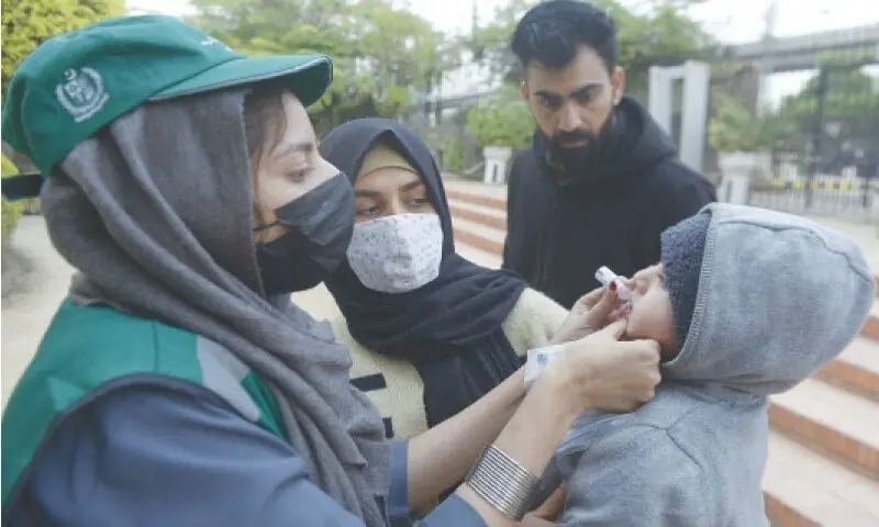 A health worker administers anti-polio drops to a child at the Allama Iqbal Park in Rawalpindi on Monday. — Photo by Mohammad Asim./File A health worker administers anti-polio drops to a child at the Allama Iqbal Park in Rawalpindi on Monday. — Photo by Mohammad Asim./File