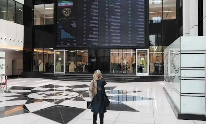 : A woman looks at an electronic board showing stock prices, following the outbreak of the coronavirus disease (COVID-19), at Tehran Stock Exchange in Tehran, Iran, May 12, 2020. &mdash;AFP/File