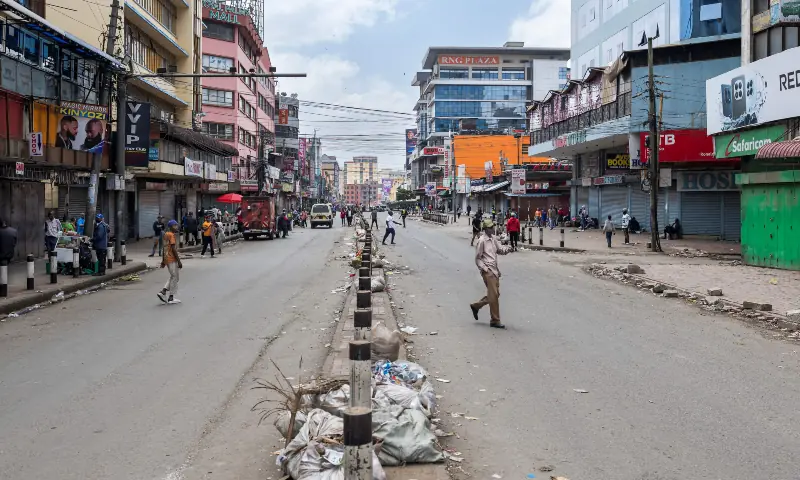 People cross a near abandoned street in the central business district during a nationwide strike by transporters now in it’s second day over fuel price hikes in Nairobi on May 19, 2026. — AFP