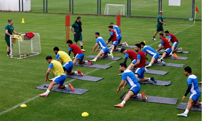 ANTALYA: Iran&rsquo;s football players stretch during a training session at the Mardan Sports Complex on Tuesday.&mdash;Reuters
