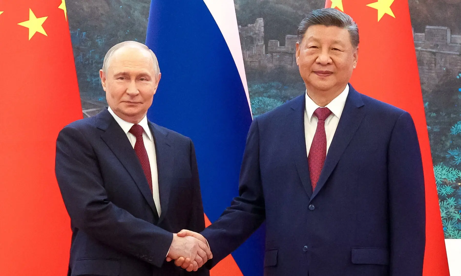 Russian President Vladimir Putin and Chinese President Xi Jinping pose for a picture during a meeting at the Great Hall of the People in Beijing, China May 20, 2026. &mdash; Sputnik via Reuters