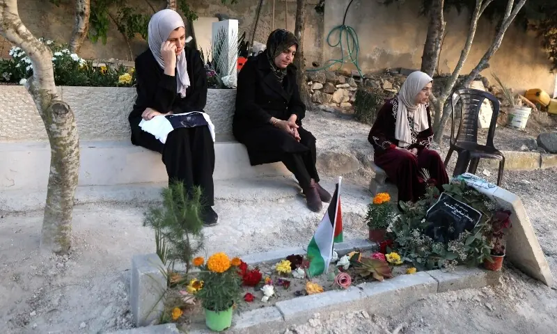 Palestinian female relatives visit the grave of 15-year-old Youssef Sameh Shtayyeh who was killed on April 23, by Israeli soldiers in the city of Nablus, at the cemetery in the village of Till, west of Nablus, in West Bank on May 12, 2026. — AFP