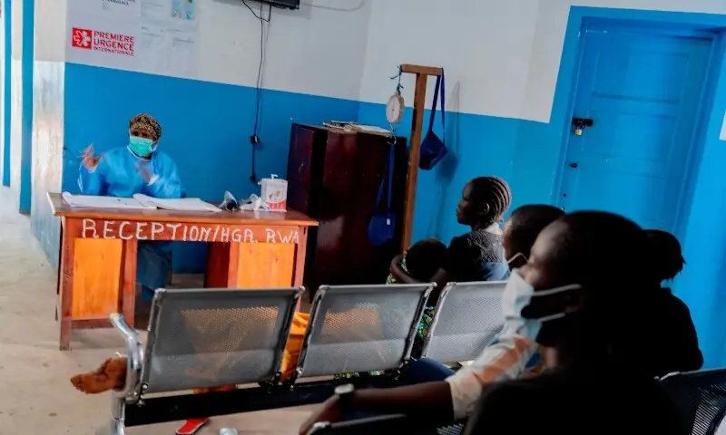 A staff member wearing personal protective equipment sits at the reception desk at a hospital in Rwampara on May 19, 2026. &mdash;AFP