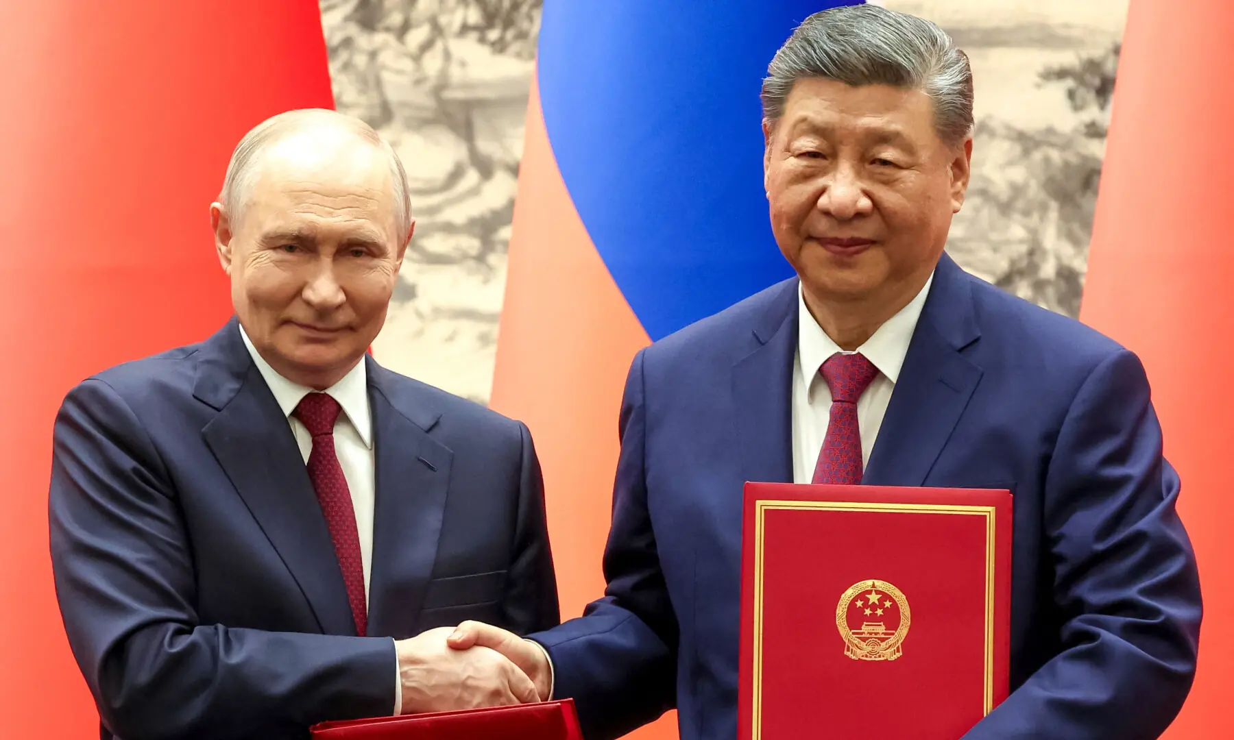 In this pool photograph distributed by the Russian state agency Sputnik, Russia's President Vladimir Putin and China's President Xi Jinping shake hands during a signing ceremony following their talks in Beijing on May 20, 2026. — AFP In this pool photograph distributed by the Russian state agency Sputnik, Russia's President Vladimir Putin and China's President Xi Jinping shake hands during a signing ceremony following their talks in Beijing on May 20, 2026. — AFP