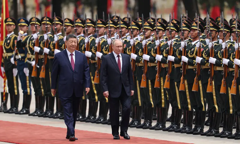 Chinese President Xi Jinping and his Russian counterpart Vladimir Putin inspect a guard of honour during a welcoming ceremony at the Great Hall of the People in Beijing.—Reuters Chinese President Xi Jinping and his Russian counterpart Vladimir Putin inspect a guard of honour during a welcoming ceremony at the Great Hall of the People in Beijing.—Reuters