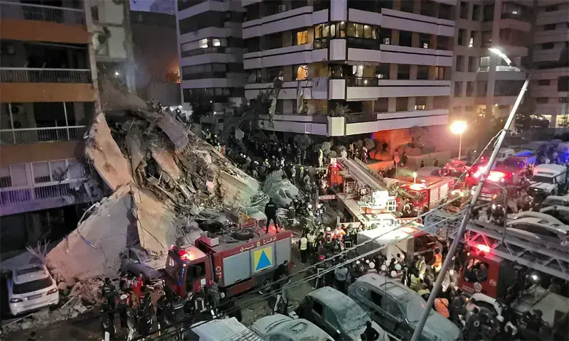 Rescuers and residents gather at the site of an Israeli air strike in Beirut&rsquo;s Tallet al-Khayyat area.&mdash;AFP/File
