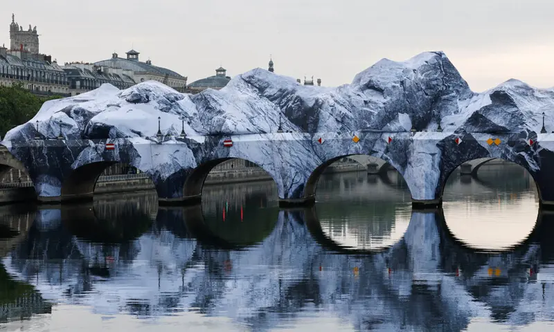 Pont Neuf Cave, conceived by French street artist JR, is revealed to the public after being inflated overnight on the Pont Neuf bridge.—Reuters Pont Neuf Cave, conceived by French street artist JR, is revealed to the public after being inflated overnight on the Pont Neuf bridge.—Reuters