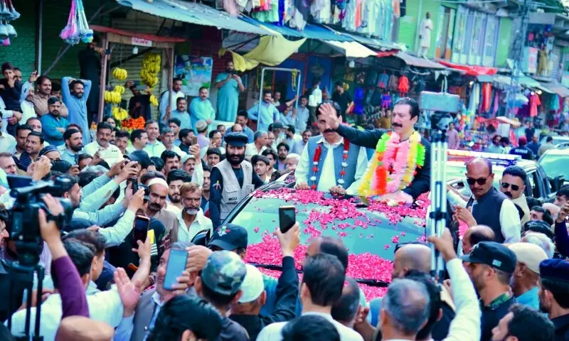 AJK Prime Minister Faisal Mumtaz Rathore waves to slogan-chanting supporters in Garhi Dupatta on May 22, 2026. — Photo by author AJK Prime Minister Faisal Mumtaz Rathore waves to slogan-chanting supporters in Garhi Dupatta on May 22, 2026. — Photo by author