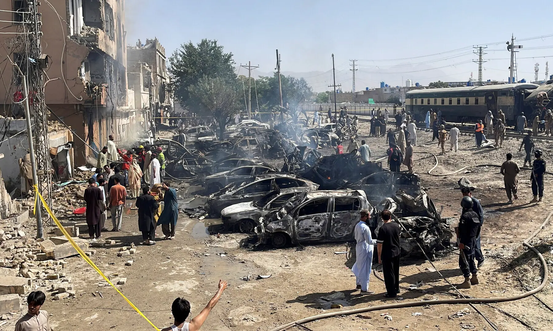 People and police officers gather after a blast near a railway track in Quetta on May 24, 2026. — Reuters People and police officers gather after a blast near a railway track in Quetta on May 24, 2026. — Reuters
