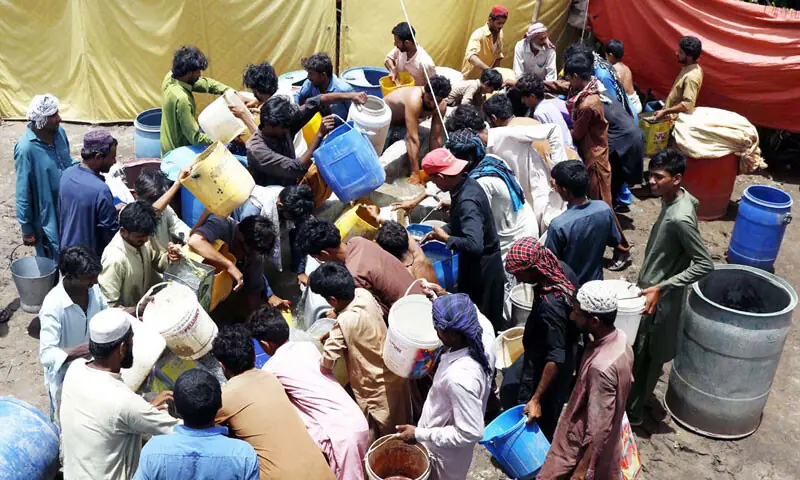 WHILE Hyderabad is experiencing an acute shortage of drinking water, people throng a small storage facility at the Hatri cattle market on Sunday to fetch turbid water for their sacrificial animals.—Dawn WHILE Hyderabad is experiencing an acute shortage of drinking water, people throng a small storage facility at the Hatri cattle market on Sunday to fetch turbid water for their sacrificial animals.—Dawn