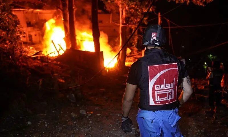 Emergency personnel work to extinguish a fire at a civil defence centre following an Israeli airstrike in the southern city of Nabatieh overnight into on May 24, 2026. &mdash;AFP