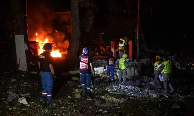 Emergency personnel work to extinguish a fire at a civil defence centre following an Israeli airstrike in the southern city of Nabatieh overnight into on May 24, 2026. &mdash;AFP