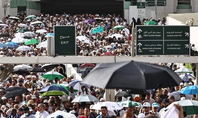 Muslim worshippers walk along the Grand Mosque complex under the water-mist fans installed in Makkah on May 24, 2026, ahead of the annual Haj pilgrimage. — AFP Muslim worshippers walk along the Grand Mosque complex under the water-mist fans installed in Makkah on May 24, 2026, ahead of the annual Haj pilgrimage. — AFP