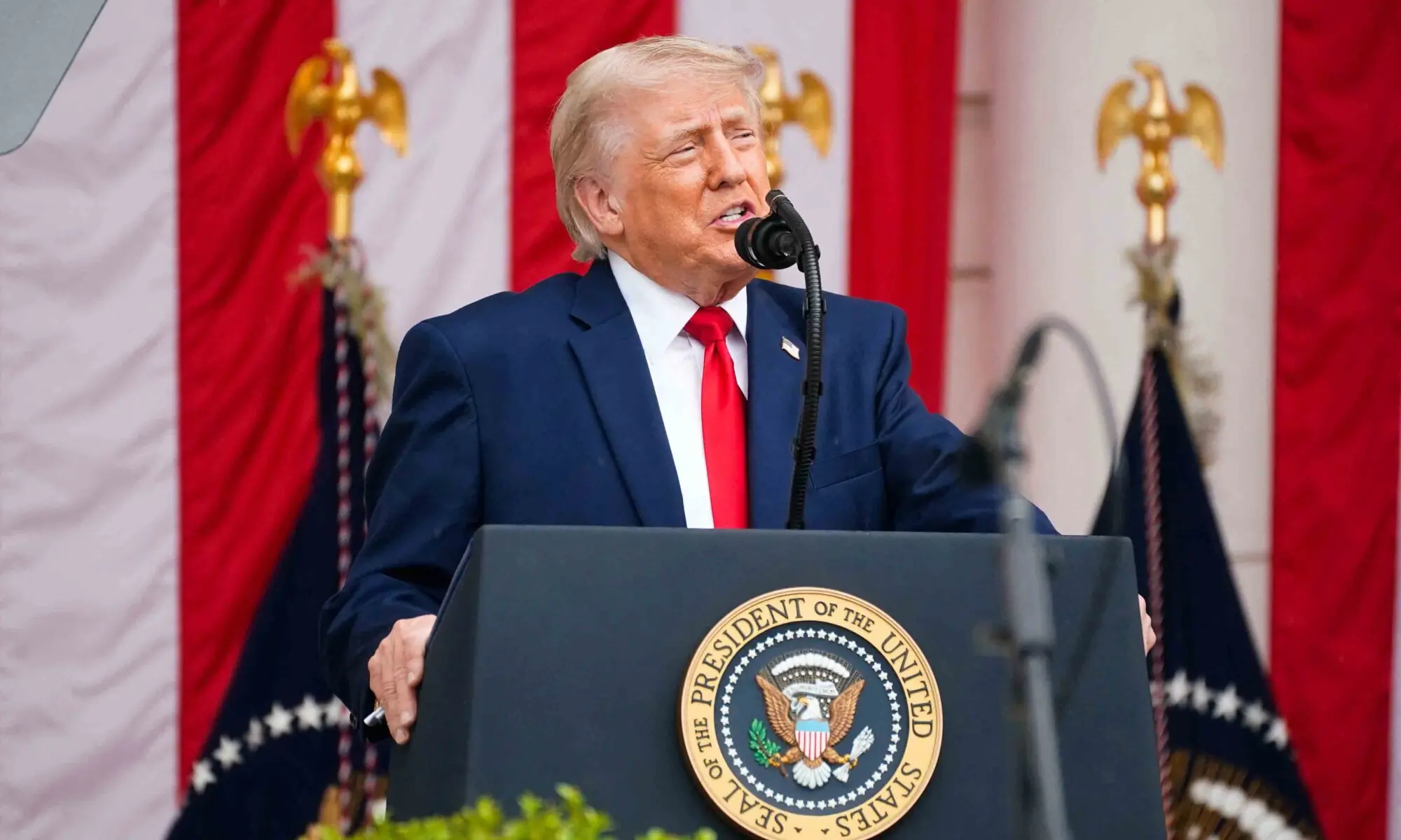 US President Donald Trump delivers remarks in the Memorial Amphitheater during a Memorial Day event at Arlington National Cemetery, Arlington, Virginia on May 25, 2026. &mdash; Reuters