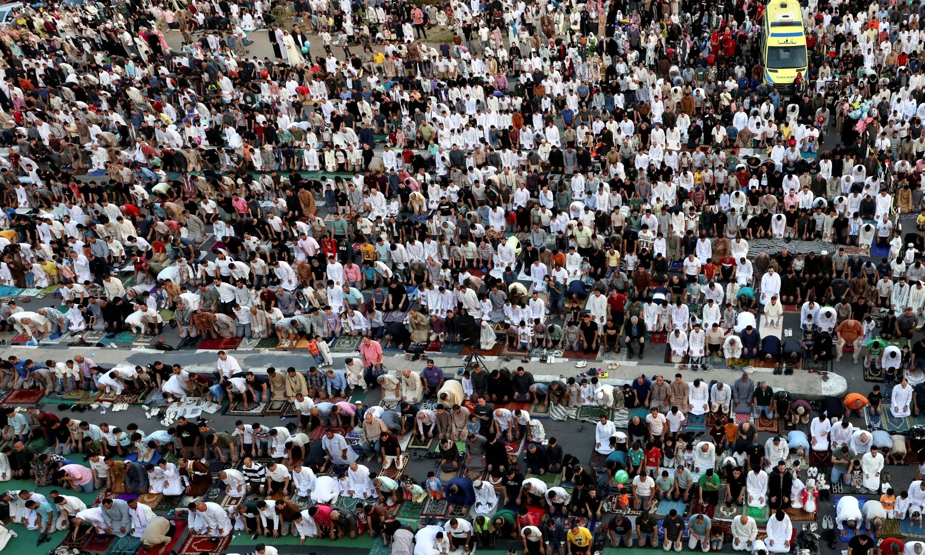  Muslims attend an Eid al-Adha prayer at a public park, outside El-Seddik Mosque in Cairo, Egypt, May 27. — Reuters 