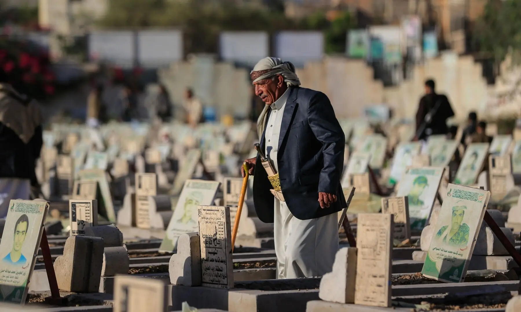 A Yemeni man visits a graveyard on the first day of Eid al-Adha, the Feast of Sacrifice, in Sanaa on May 27. — AFP