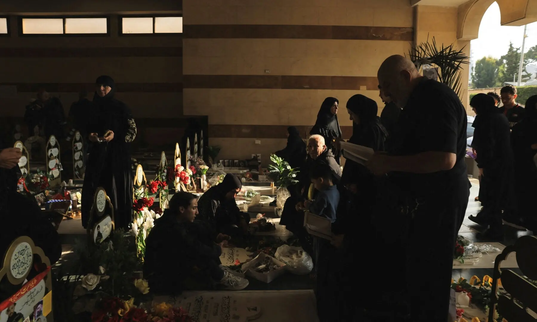 People visit the graves of their loved ones on Eid al-Adha, in Beirut southern suburbs, Lebanon, May 27. — AFP