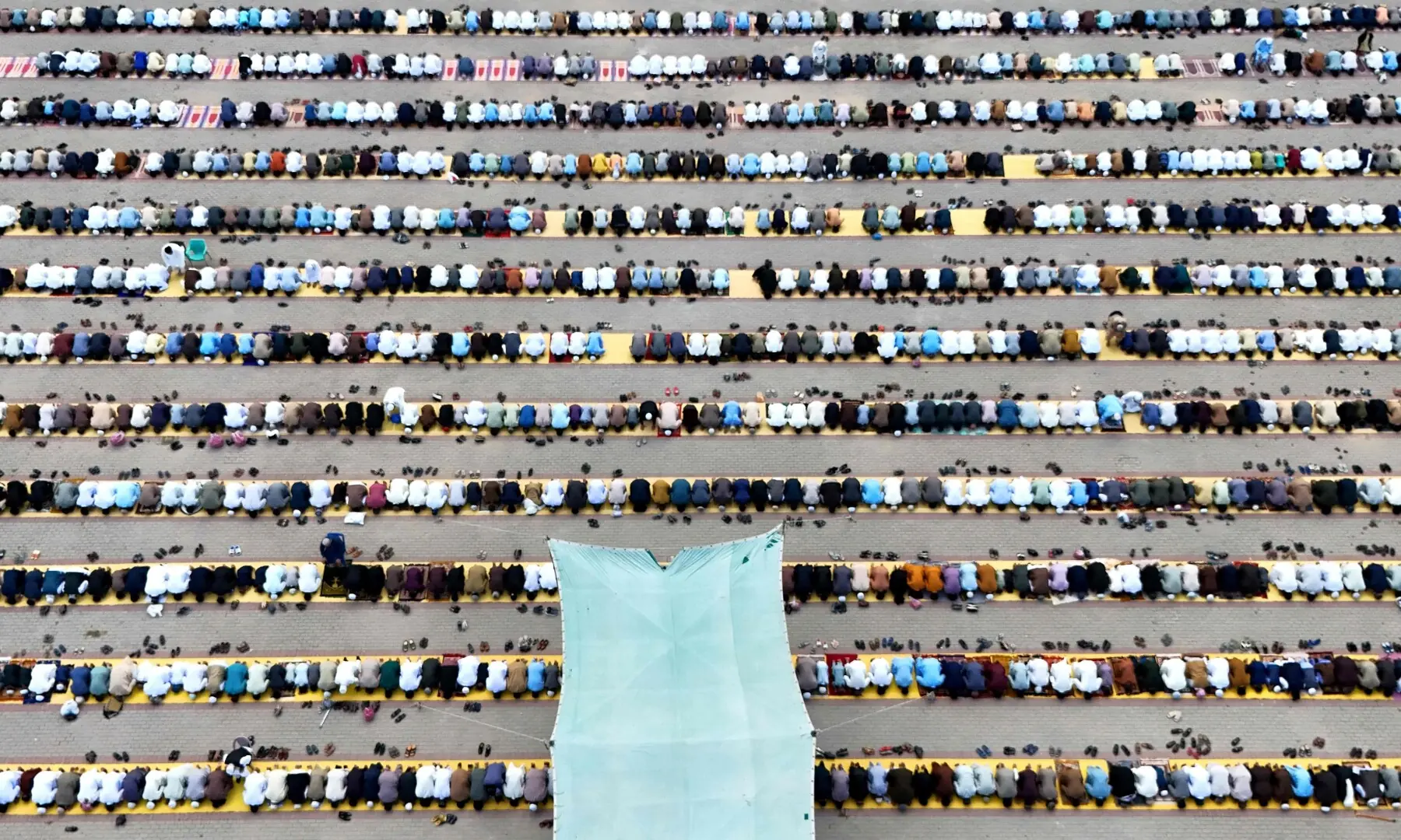 An aerial view shows Muslim devotees offering Eid al-Adha prayers at the Eidgah ground in Rawalpindi on May 27. — AFP