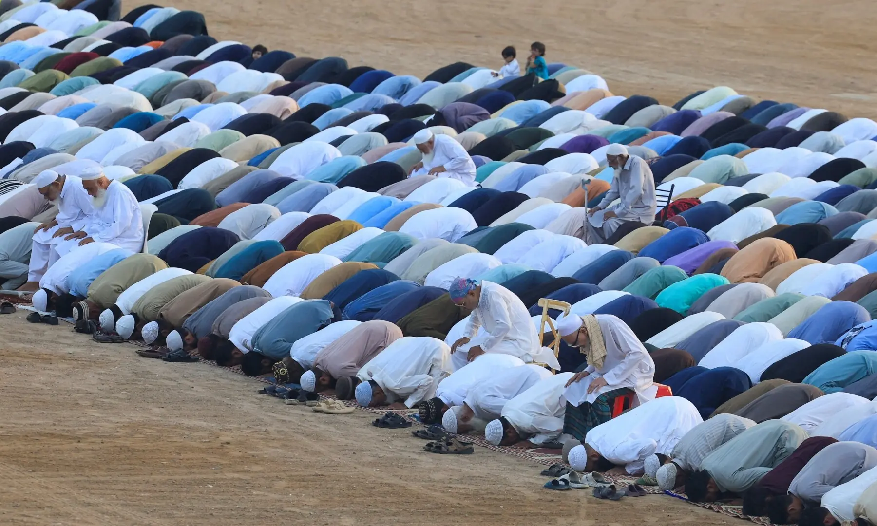 People offer Eid al-Adha prayers at the Railway Ground in Karachi, Pakistan, May 27. — Reuters