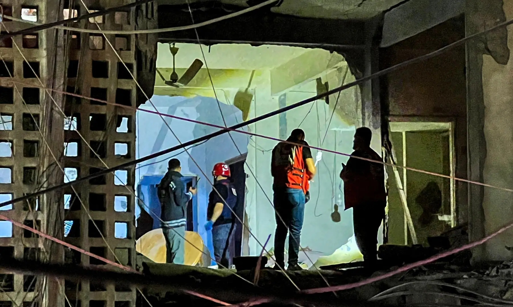 First responders and local residents inspect the damage to a building following an Israeli strike in Sidon, southern Lebanon on May 28, 2026. &mdash; AFP