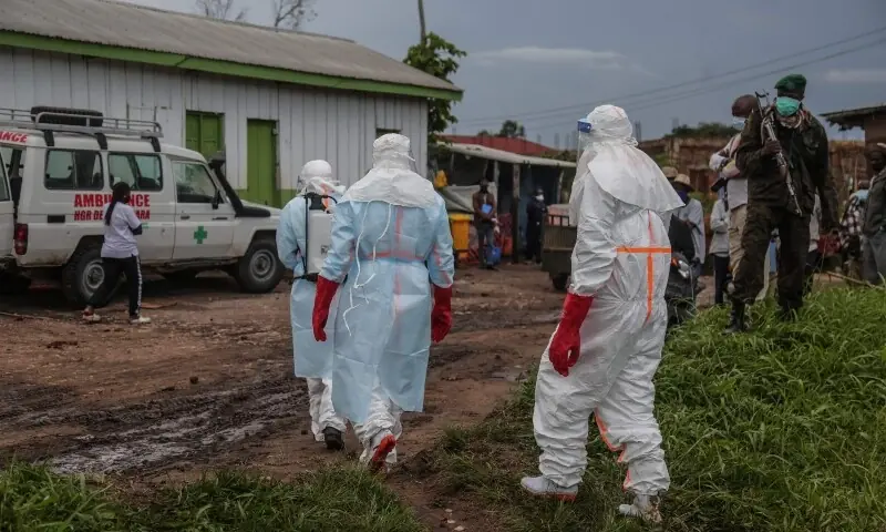 Medical staff wearing personal protective equipment walk at a hospital in Rwampara on May 21, 2026. — AFP Medical staff wearing personal protective equipment walk at a hospital in Rwampara on May 21, 2026. — AFP