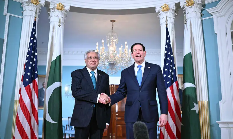 DEPUTY PM Ishaq Dar shakes hands with US Secretary of State Marco Rubio.&mdash;AFP