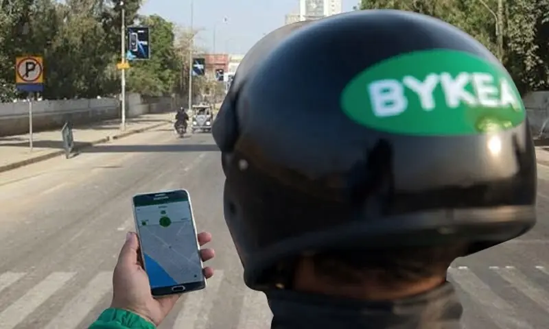 The image shows a bykea rider checking the application on phone. — Photo courtesy Bykea Facebook The image shows a bykea rider checking the application on phone. — Photo courtesy Bykea Facebook