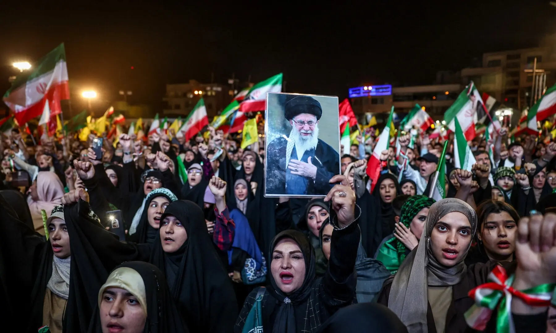 A woman holds up an image of late Iranian Supreme Leader Ayatollah Ali Khamenei during a rally in Tehran, Iran on May 29, 2026. &mdash; Reuters