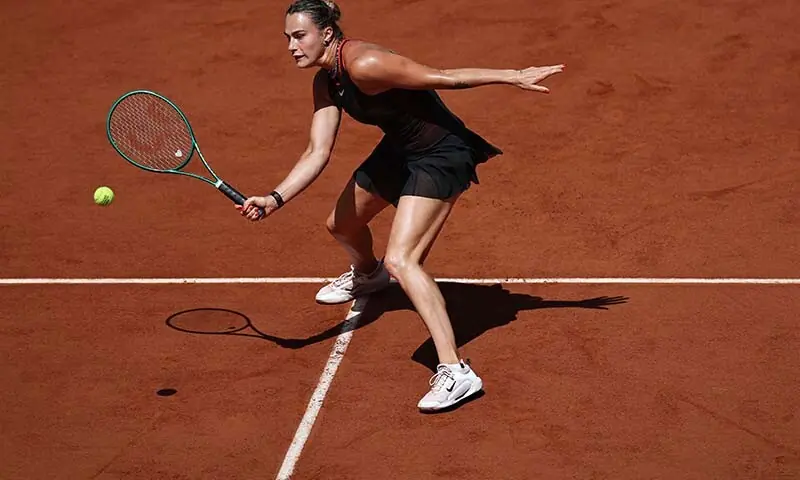 Aryna Sabalenka plays a backhand return to Australia's Daria Kasatkina during their women's singles match on day 7 of the French Open tennis tournament, on Court Suzanne-Lenglen at the Roland-Garros Complex in Paris, France on May 30, 2026. &mdash; AFP