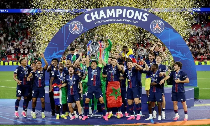 Paris St Germain's Marquinhos lifts the trophy as he celebrates with teammates after winning the UEFA Champions League &mdash; Reuters