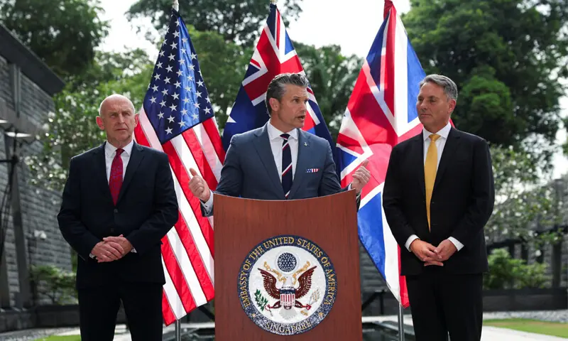 Australian Defence Minister Richard Marles and British Defence Secretary John Healey look on as US Secretary of Defence Pete Hegseth speaks at the US Embassy in Singapore.—Reuters Australian Defence Minister Richard Marles and British Defence Secretary John Healey look on as US Secretary of Defence Pete Hegseth speaks at the US Embassy in Singapore.—Reuters