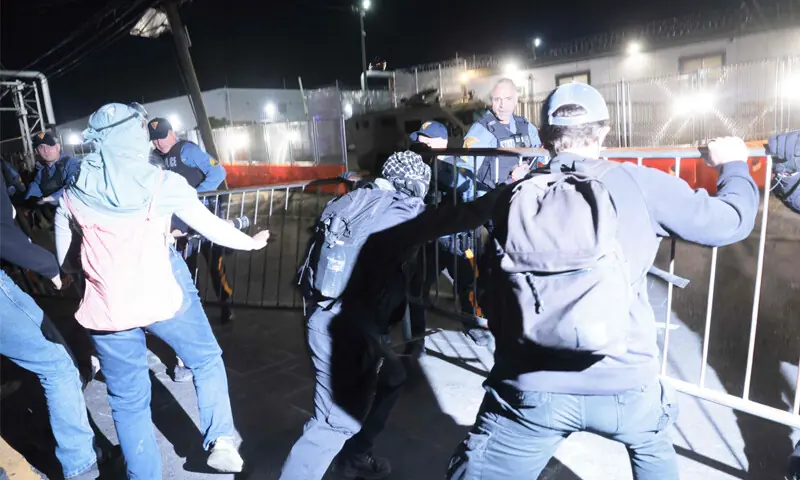 NEWARK: Protesters clash with police outside the federal immigration centre in New Jersey.—AFP NEWARK: Protesters clash with police outside the federal immigration centre in New Jersey.—AFP