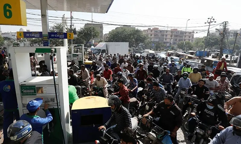 In this November 2021 photo, people on motorcycles wait for their turn to get petrol at a petrol station, after Pakistan Petroleum Dealers Association (PPDA) announced a countrywide strike, in Karachi. — Reuters/File In this November 2021 photo, people on motorcycles wait for their turn to get petrol at a petrol station, after Pakistan Petroleum Dealers Association (PPDA) announced a countrywide strike, in Karachi. — Reuters/File
