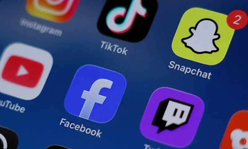 Instagram, TikTok, Snapchat, YouTube, Facebook, Twitch and Reddit applications are displayed on a mobile phone in this picture illustration taken on December 9, 2025. &mdash;Reuters/File
