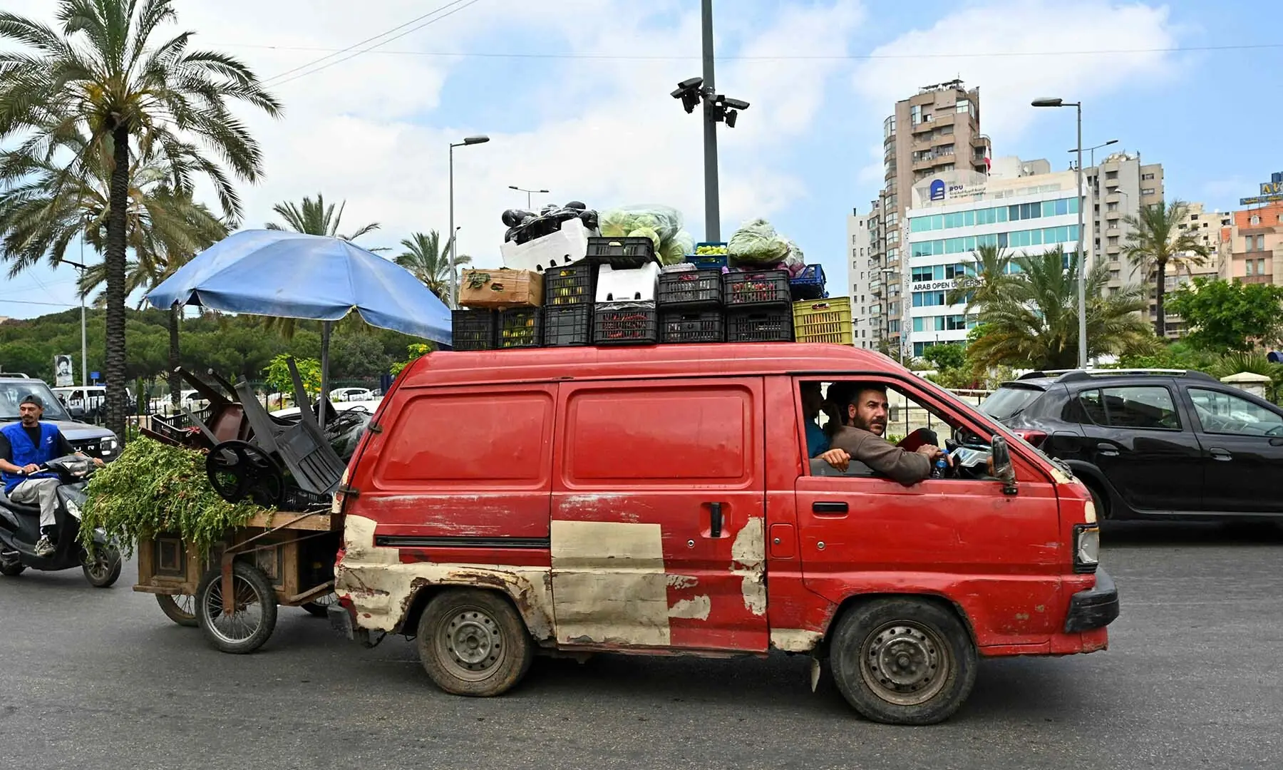 A street vendor flees with other residents after Israel ordered attacks on the southern suburbs of Lebanon&rsquo;s capital Beirut on June 1, 2026. &mdash; AFP