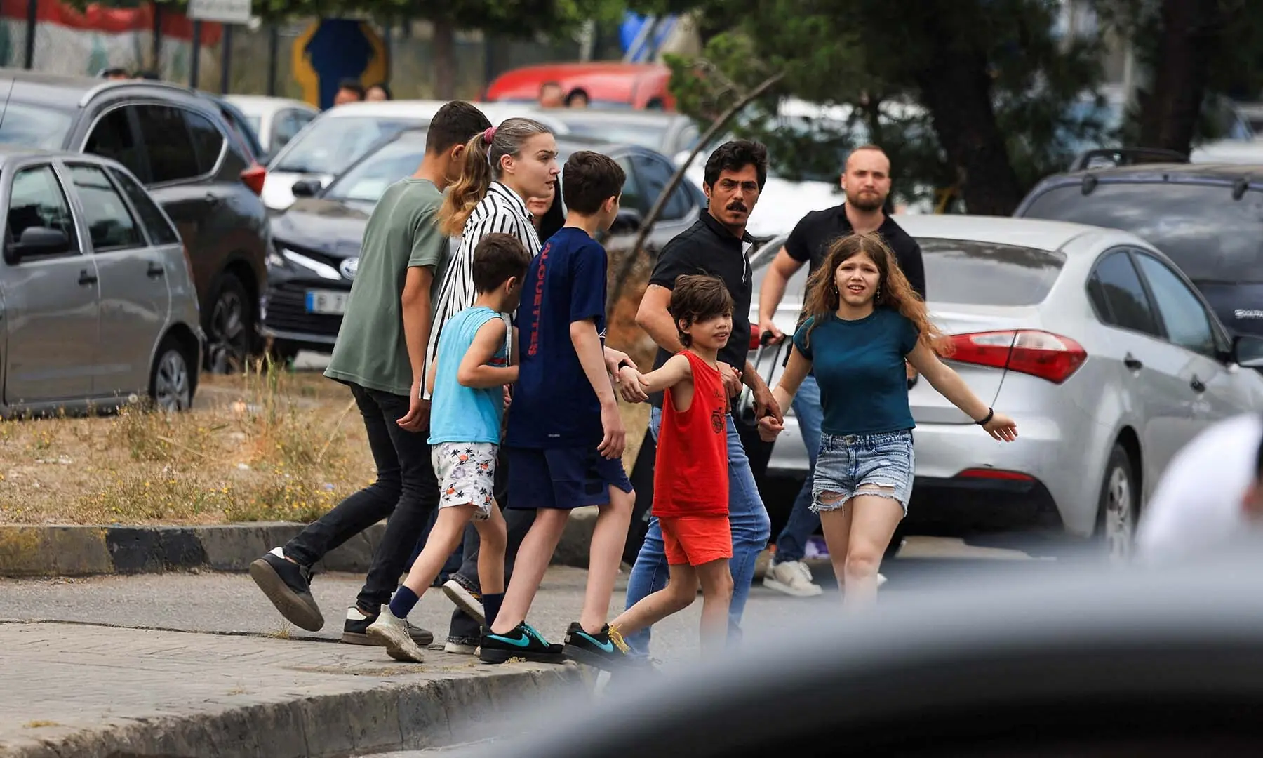 People, including children, walk along a road, as they flee the southern suburbs of Beirut, Lebanon, after Israeli Prime Minister Benjamin Netanyahu ordered the military to attack targets in the suburbs on June 1, 2026. &mdash; Reuters