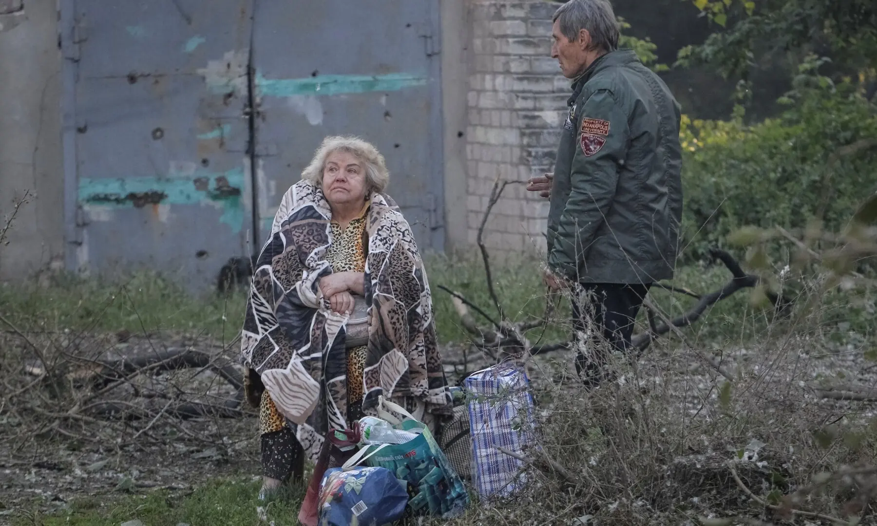 A woman sits near an apartment building damaged during a Russian drone and missile strike, amid Russia’s attack on Ukraine, in Dnipro, Ukraine June 2, 2026. —Reuters