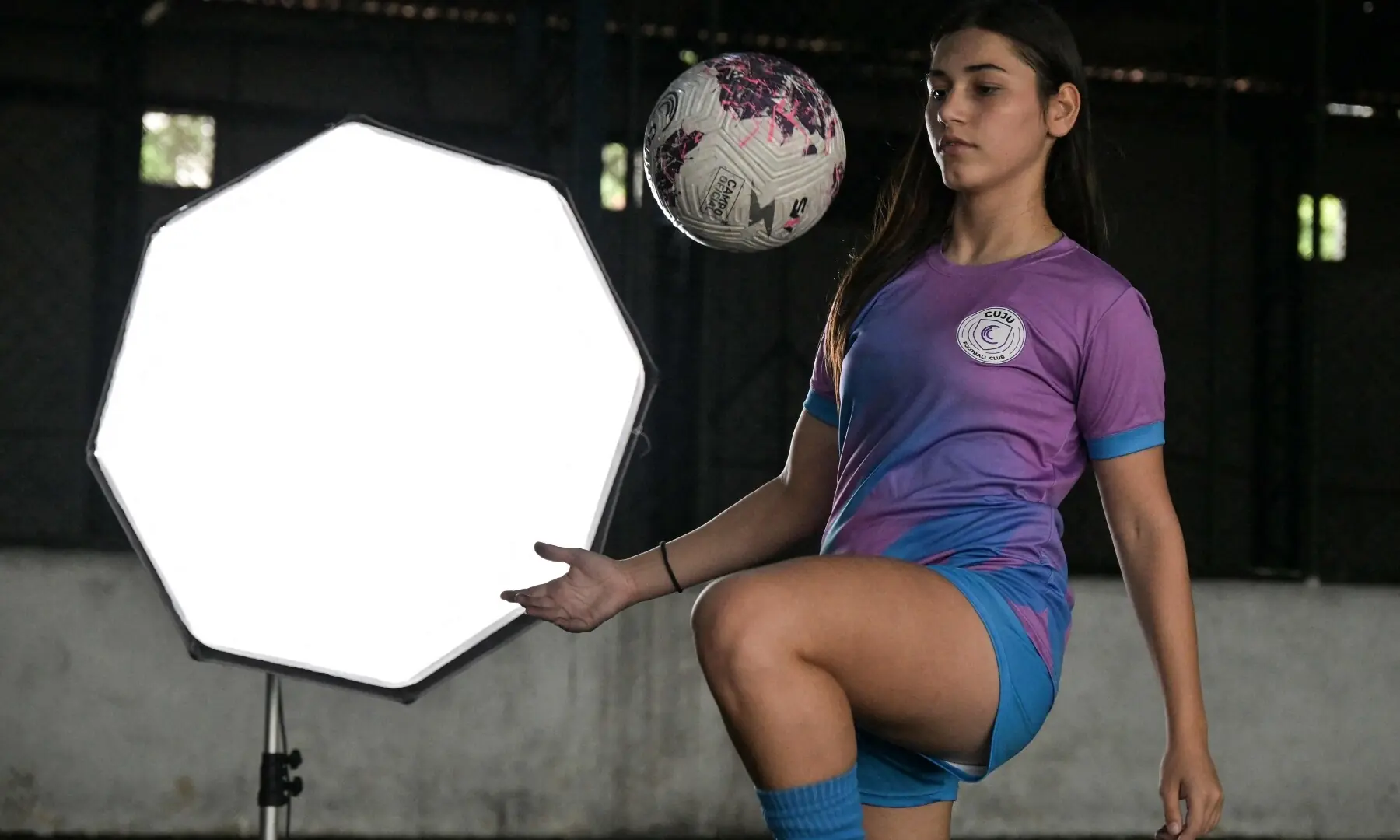 Brazilian football player Marcela Geremias de Lima controls the ball while being recorded for the Cuju app, in Sao Paulo, Brazil, on May 9, 2026. &mdash;AFP