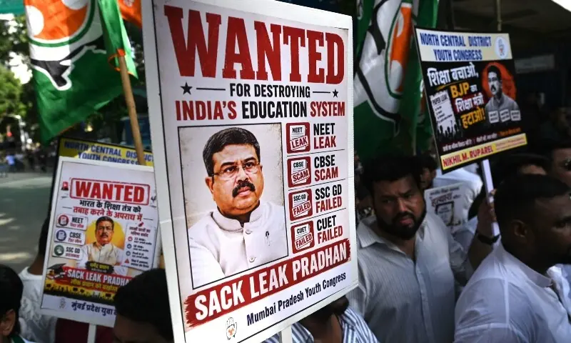 Indian Youth Congress party workers hold placards of India's Education Minister Dharmendra Pradhan during a protest against National Testing Agency over the alleged exam paper leak and subsequent rescheduling of National Eligibility-cum-Entrance Test (Undergraduate) (NEET-UG) in Mumbai on June 2, 2026. &mdash;AFP