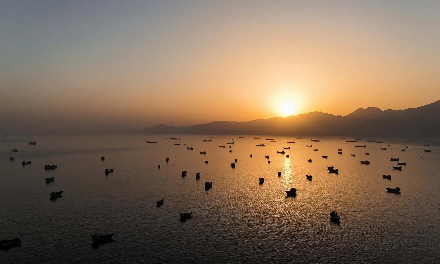 A drone view of vessels anchored in the Strait of Hormuz as seen from Musandam, Oman, on June 3, 2026. &mdash; Reuters