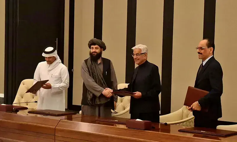 Defence Minister Khawaja Asif and Afghan Defence Minister Maulvi Sahib Muhammad Yaqub Mujahid shake hands after signing a ceasefire deal between Pakistan and Afghanistan in Doha, Qatar on October 19, 2025. &mdash; X/@KhawajaMAsif/File