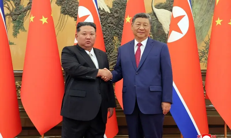 This picture taken on September 4, 2025 and released from North Korea's official Korean Central News Agency (KCNA) on September 5, 2025 shows North Korean leader Kim Jong Un (L) shaking hands with Chinese President Xi Jinping in Beijing. &mdash; AFP/File