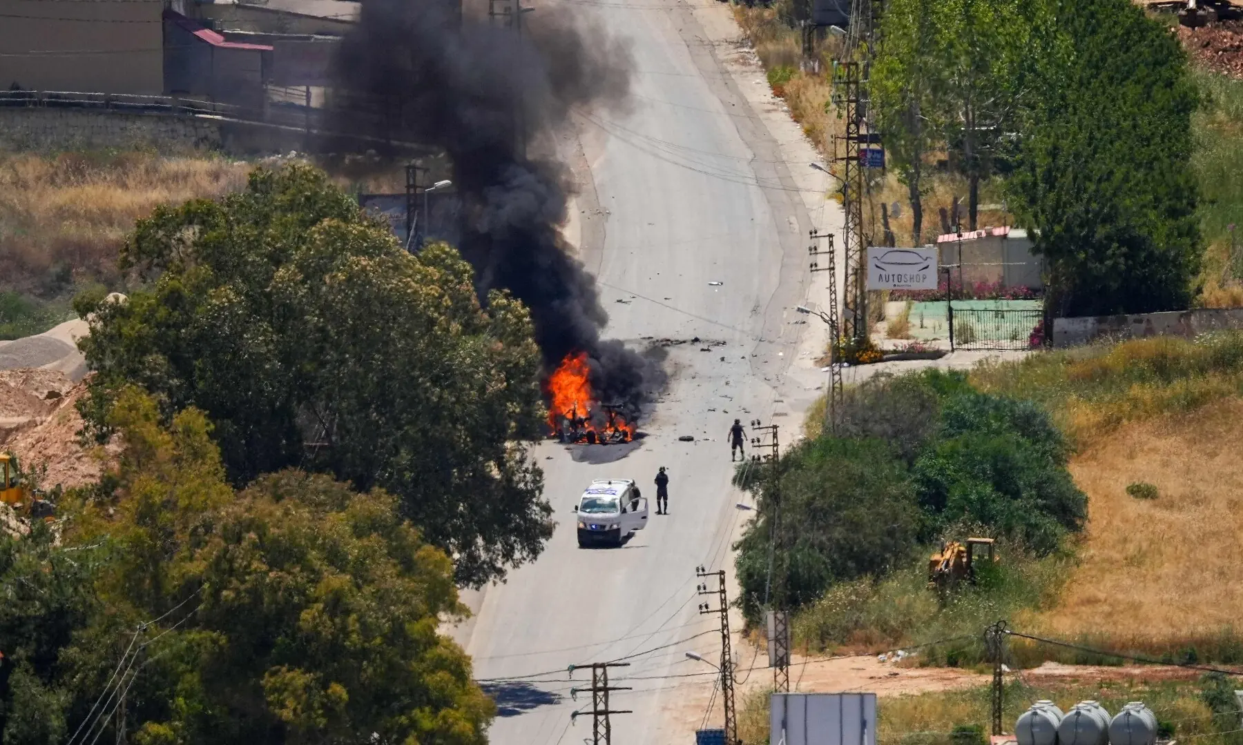 First responders attend to a burning vehicle targeted by an Israeli drone attack in the southern Lebanese city of Nabatieh on June 5, 2026. &mdash; AFP