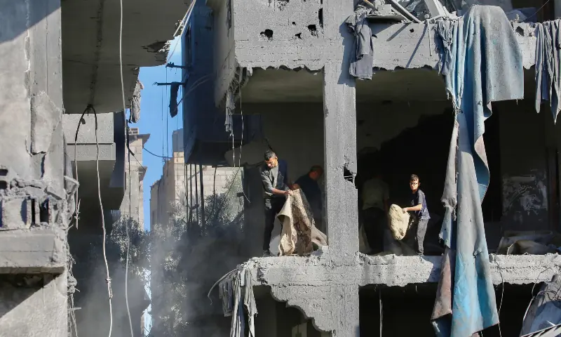 Palestinians clear debris at the site of an Israeli strike on a house whose residents were warned to evacuate before the attack, in Zawaida, central Gaza Strip on June 5, 2026. — AFP