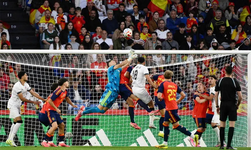 A CORUNA (Spain): Spain goalkeeper Joan Garcia jumps to clear the ball during the international friendly against Iraq at the Riazor Stadium.&mdash;AFP